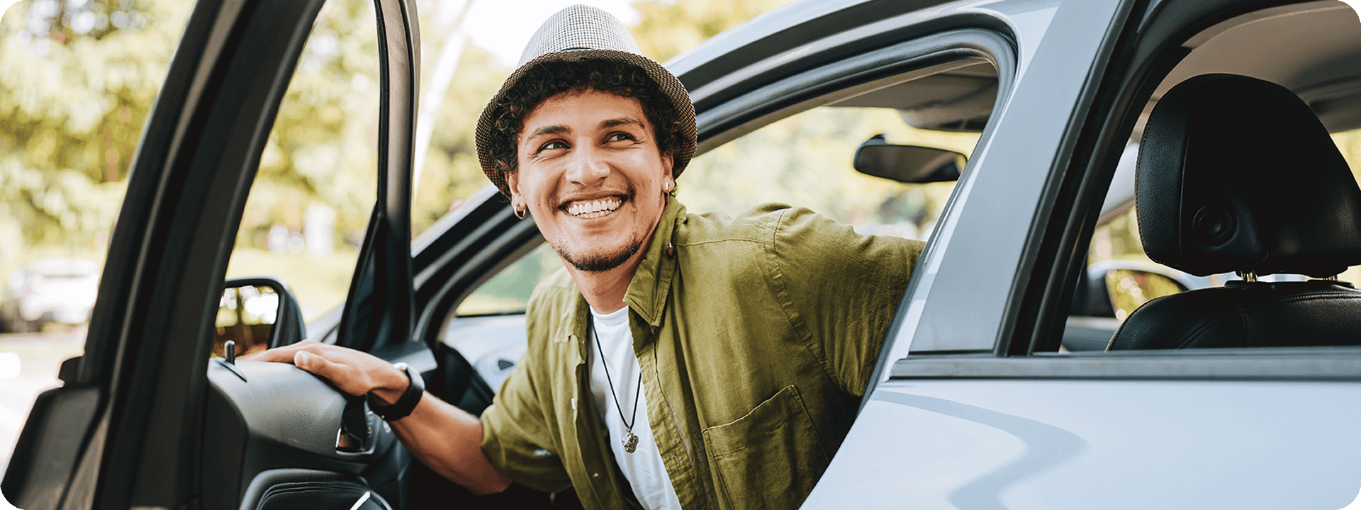 Man enjoying his new care with a 4.99% APR Auto Loan Special.