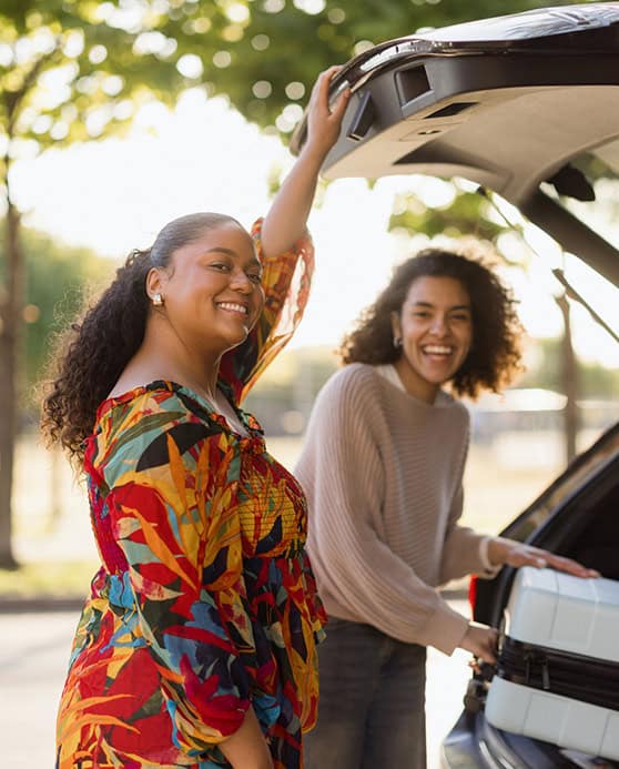 Mom and girl with new car.
